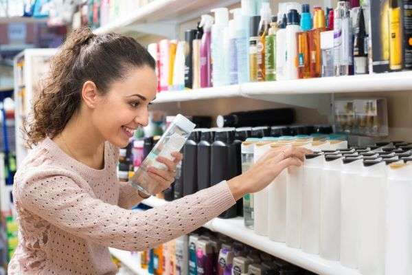 A Woman Shopping For Shampoo